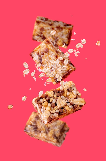 Fitness candy oatmeal flying on pink background