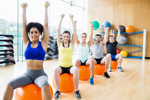 Fitness class exercising in the studio