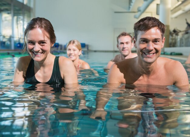 Fitness class using underwater exercise bikes