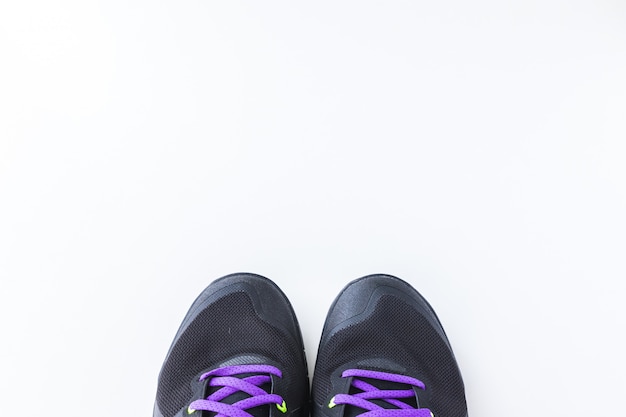 Fitness concept. Sport shoes on white background 