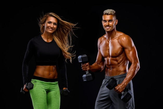 Fitness Couple Exercise Together With Weights