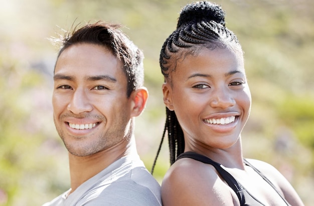 Fitness couple smile and outdoor exercise out for a run and cardio training for happiness health and wellness Portrait of athlete and sports asian man and black woman ready for a workout in nature