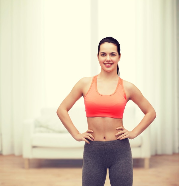 fitness and diet concept - smiling teenage girl in sportswear