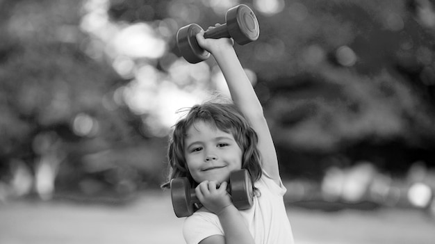 Fitness dumbbells kid exercise workout outdoor boy sporty child with dumbbells healthy activities ki