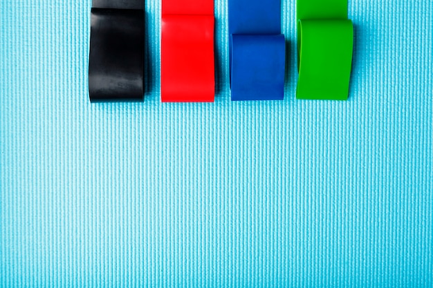 Fitness elastic bands of different colors and loads for sports