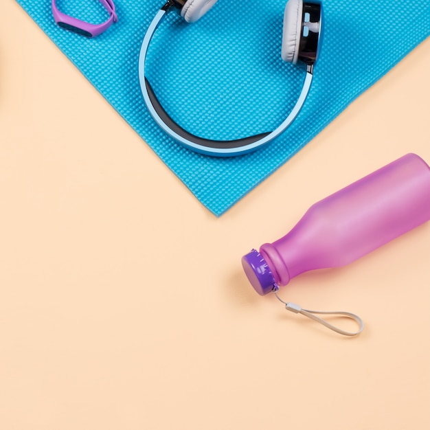 fitness equipment. woman workout accessories and clothes flat lay. top view, fitness background