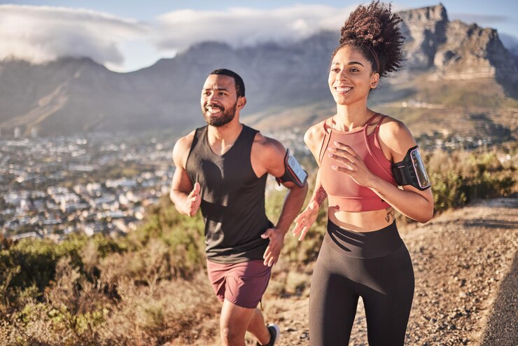 Photo fitness exercise and couple running on mountain together for healthy body wellness and workout motivation nature and black man and woman exercising doing workout and marathon training in city