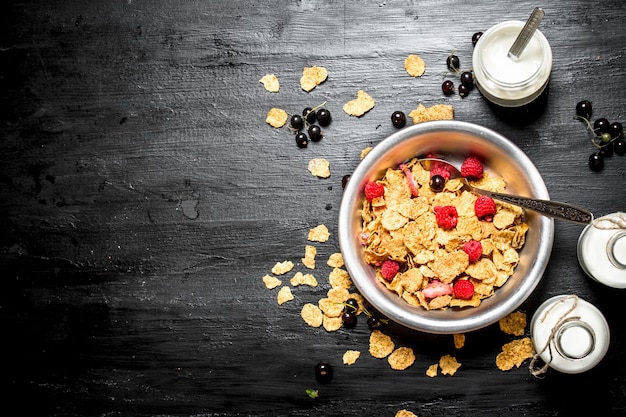 Fitness food. Muesli with ripe berries and milk.