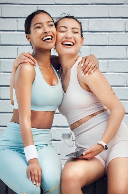 Fitness friends and exercise partner with happy women outdoor for training cardio workout and mental wellness Friendship athlete and runner females hugging for motivation sports and healthy fun