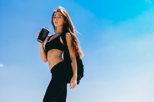 Fitness girl with a shaker