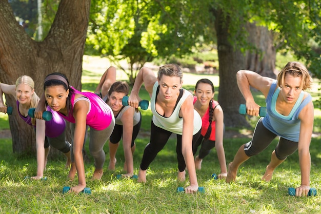 Fitness group planking in park