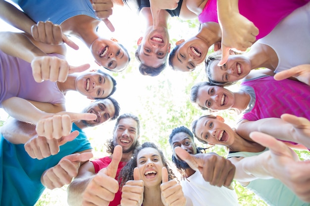 Fitness group smiling at camera in park