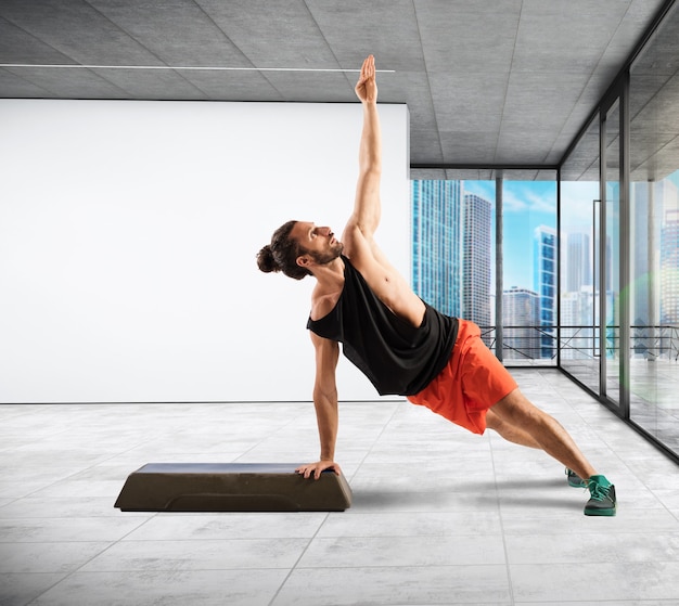 Fitness instructor in balance on the step