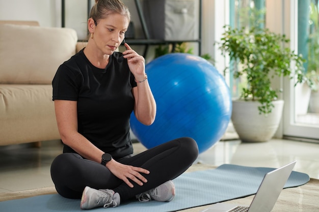 Fitness Instructor Checking Microphone