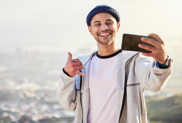 Photo fitness man and sunset with smile for selfie on mountain in social media vlog or profile picture in nature happy male hiker smiling for photo memory or online post in healthy wellness outdoors