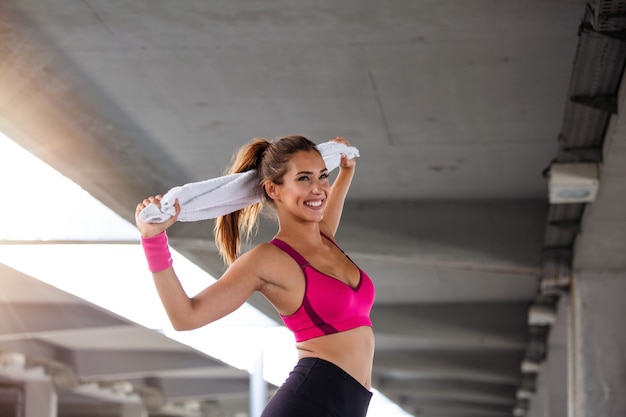 Fitness model working out on the street