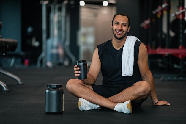 Fitness Nutrition Black Athlete With Sport Shaker Bottle And Whey Powder Container