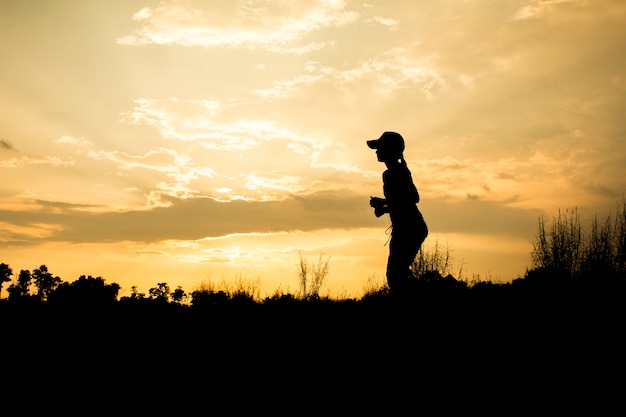 Photo fitness silhouette sunrise jogging workout wellness concept