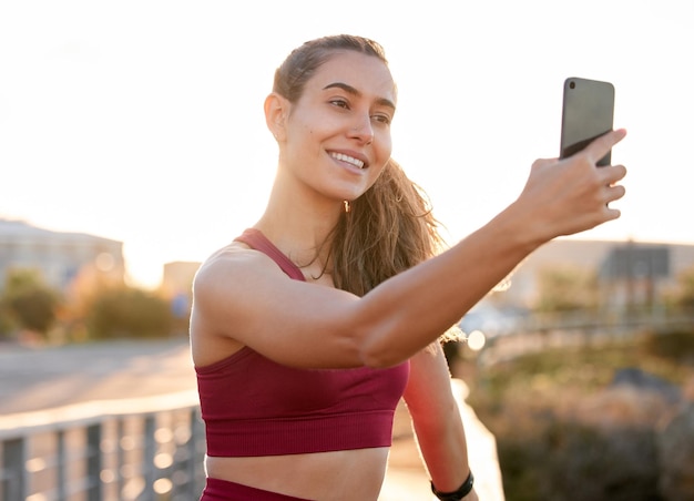 fitness smile and selfie with woman in city for running health and social media app sports workout and wellness with person and picture in outdoors for photography training plan and memory