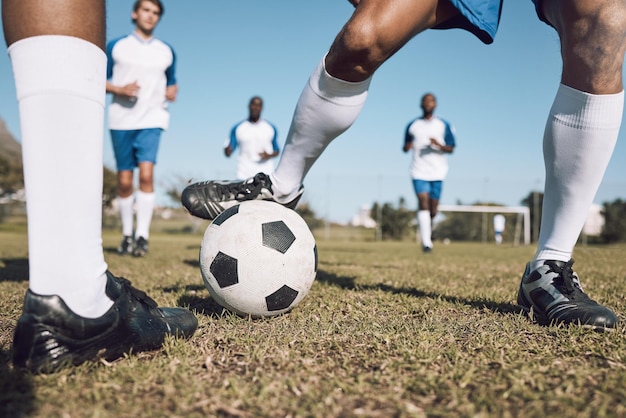 Photo fitness soccer team and athletes playing on the field at a game competition league or championship sports football and male sport players running with a ball at an outdoor match on soccer field