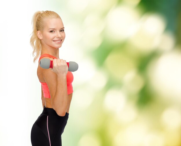 fitness, sport and diet concept - smiling beautiful sporty woman with dumbbell