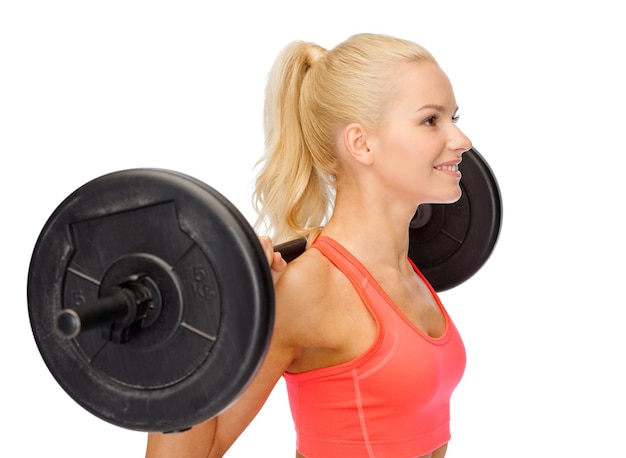 fitness, sport and dieting concept - smiling sporty woman exercising with barbell