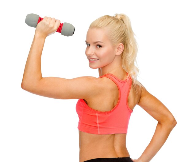 fitness, sport en dieet concept - jonge sportieve vrouw met lichte dumbbell