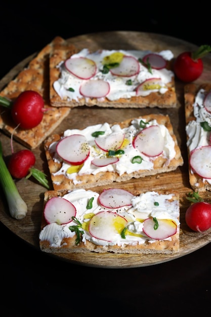 Fitness toast with radishes green onions and white cheese Healthy food