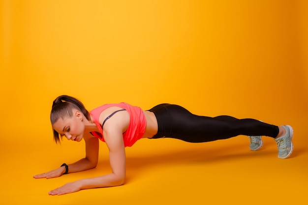 fitness trainer doing plank exercise