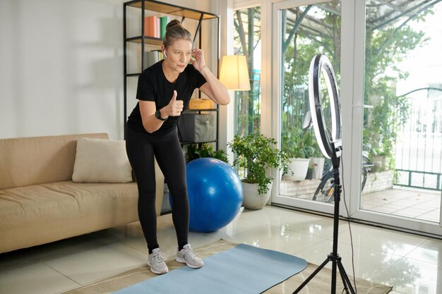 Fitness Trainer Tecording Workout Video