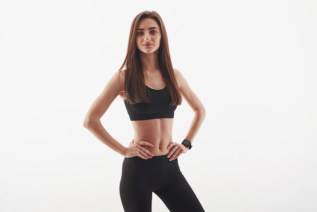 Fitness trainer. Young beautiful woman standing