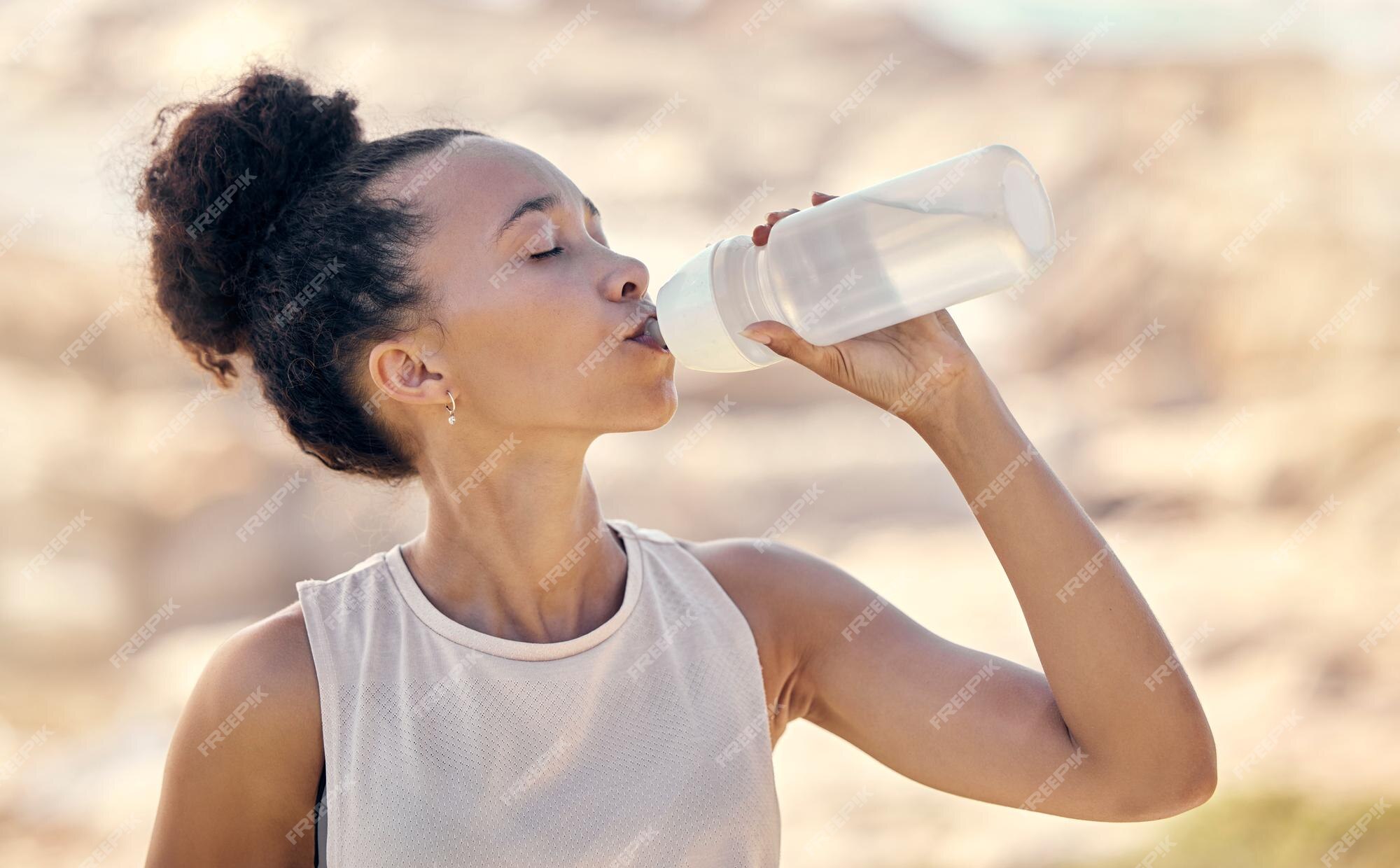 https://img.freepik.com/premium-photo/fitness-wellness-black-woman-drinking-water-after-exercise-training-workout-nature-park-outdoors-hydration-health-thirsty-female-athlete-drink-from-water-bottle-after-running_590464-102154.jpg?w=2000