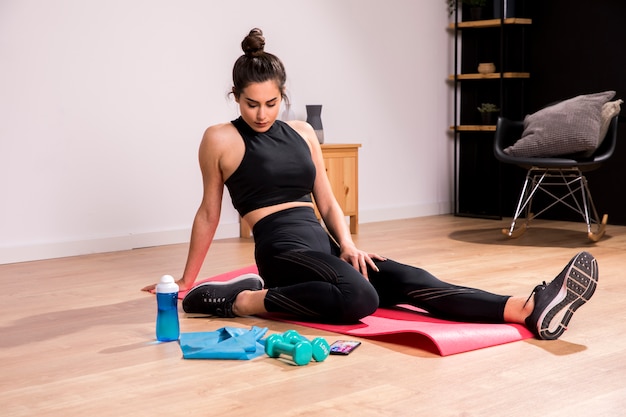 Fitness woman doing exercise at home