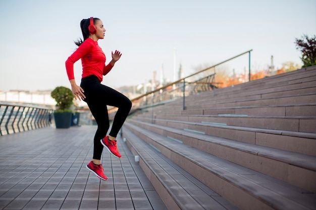 Fitness woman jumping outdoor