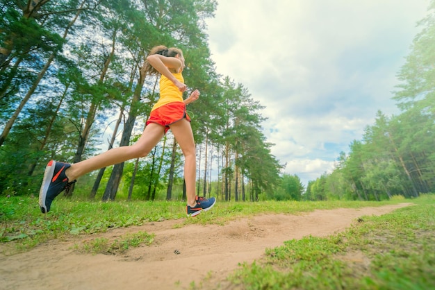 Fitness woman running outdoors