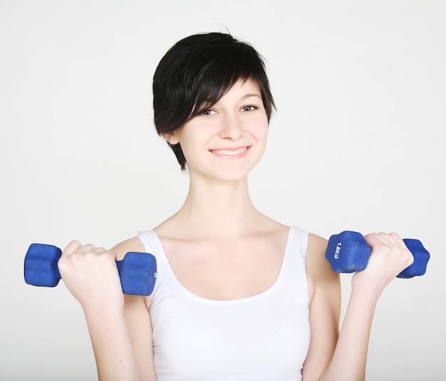 Fitness woman with dumbbells