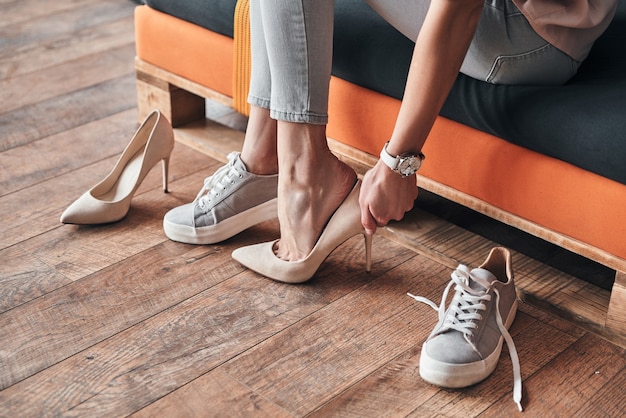 Photo fits perfect. close up of young woman trying on elegant shoes with high heels