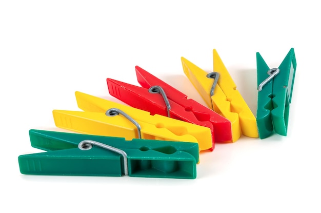 Five colorful plastic clothespins