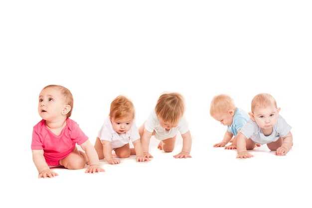Five crawling babies isolated on white background