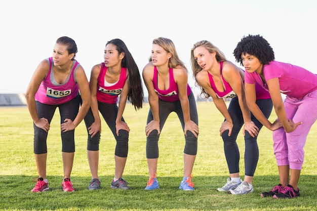 Five focused runners supporting breast cancer marathon