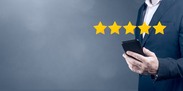 Five stars 5 rating with businessman touching screen, concept about positive customer feedback