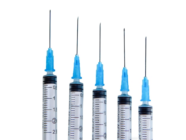 Five syringes on a white background