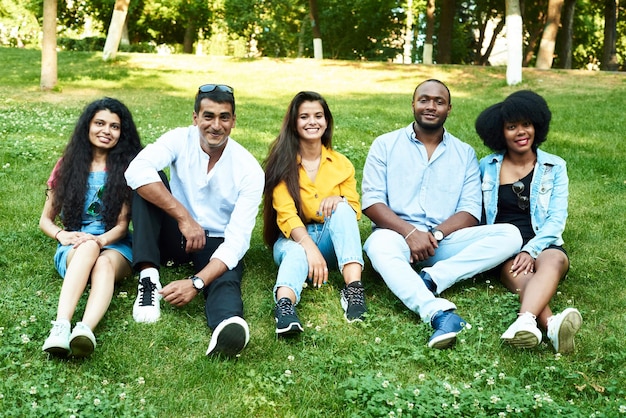 Five young people of different races communicate with each other