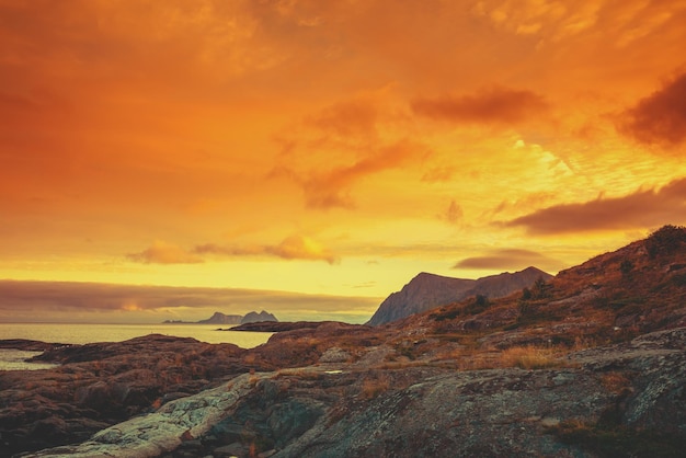 Fjord at sunset Rocky seashore in the evening Beautiful nature of Norway