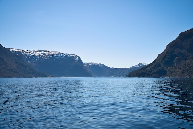 Fjord with view of mountains and fjord landscape in norway landscape with blue sky