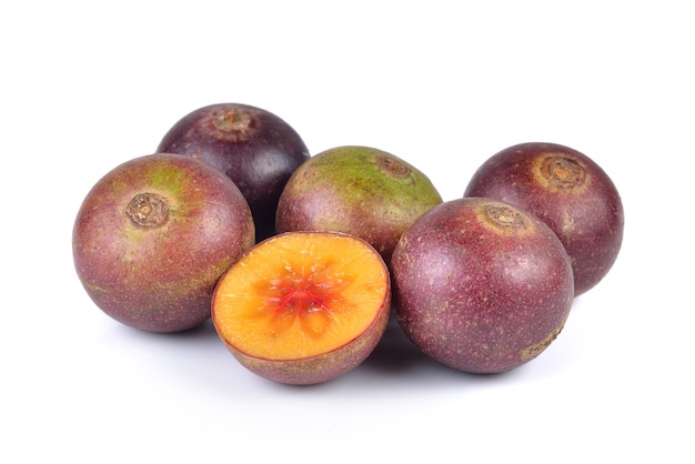 Flacourtia fruit on white background