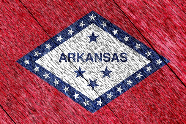 Photo flag of arkansas state usa flag on a textured background concept collage