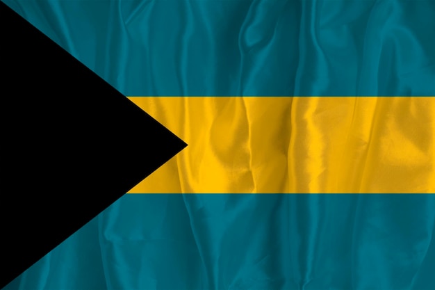 The flag of the Bahamas on a silk background is a great national symbol Fabric texture The official state symbol of the country