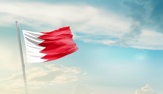 A flag of bahrain with the sun shining on it