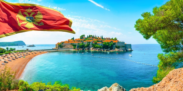 Flag and beach at Sveti Stefan